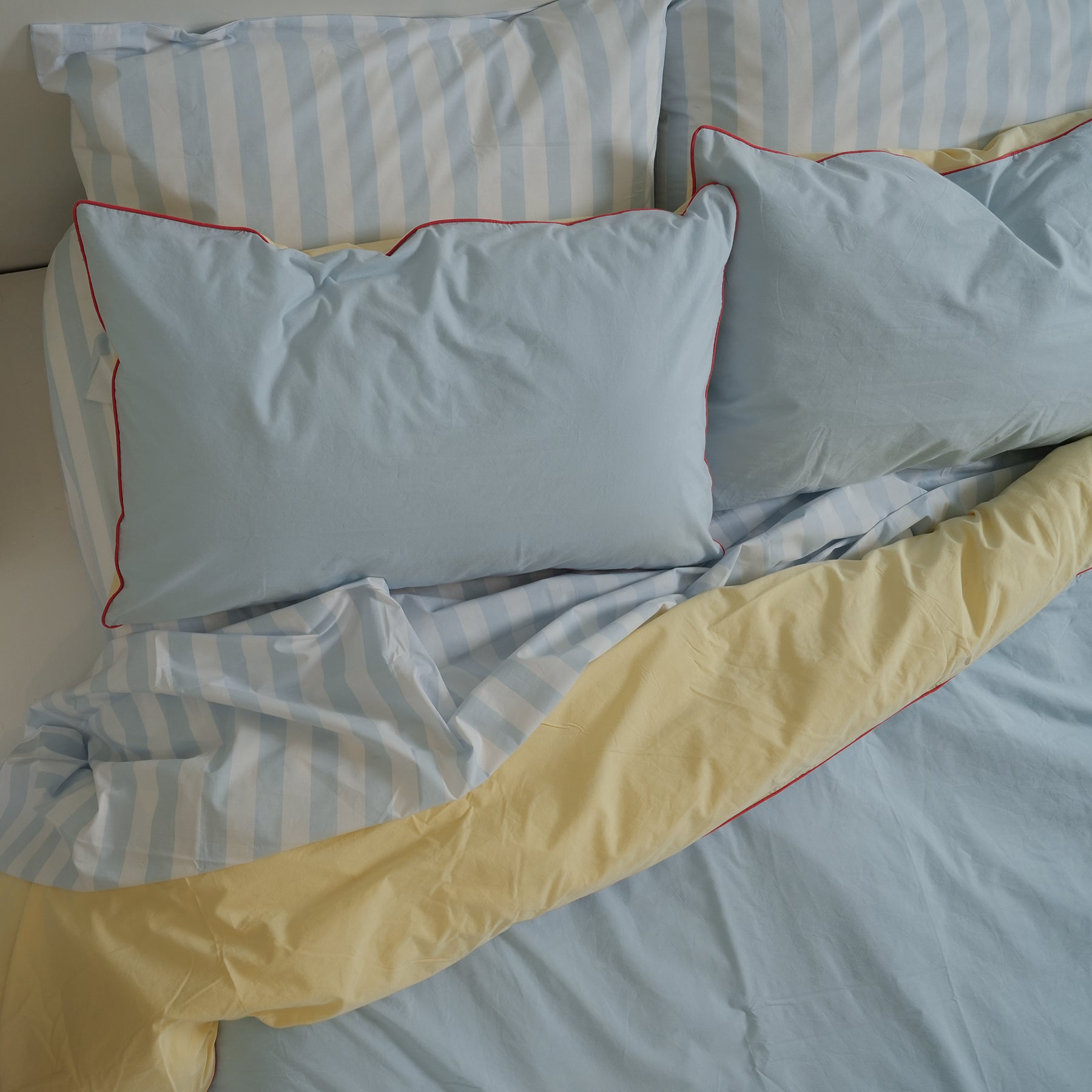 100% stonewashed cotton duvet set in butter/sky reversible, side view