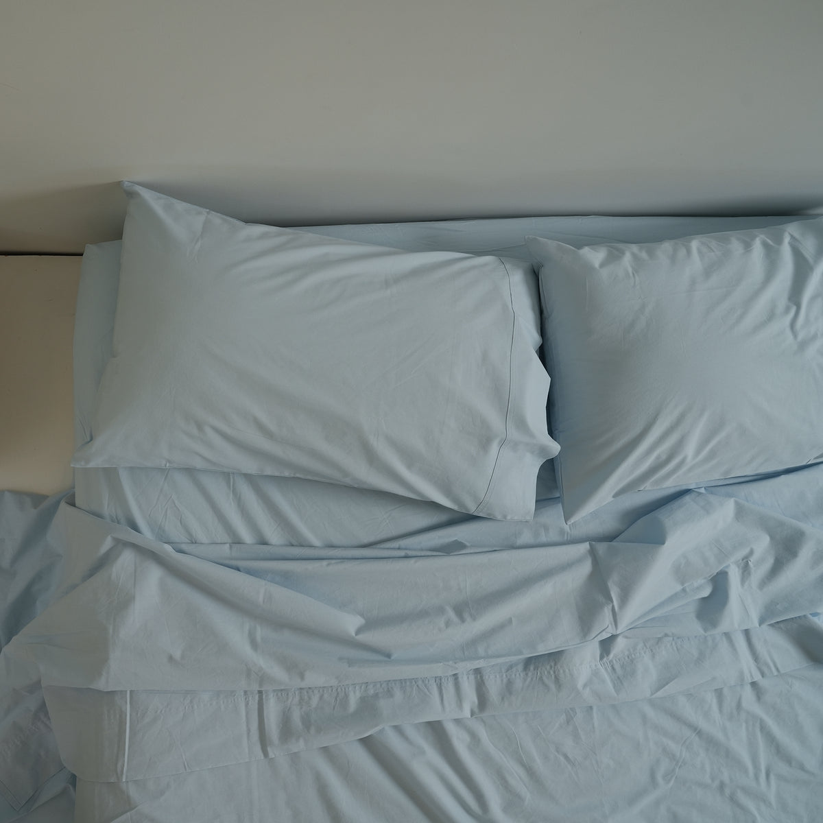 100% stonewashed cotton pillowcase pair in sky blue, close-up