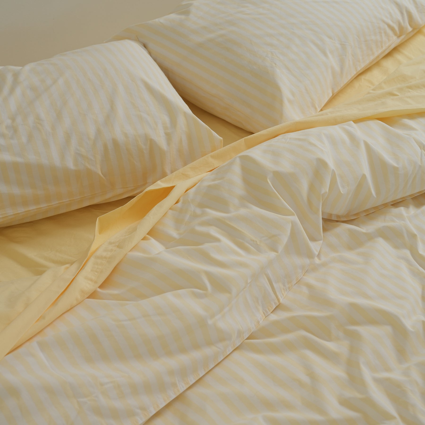 100% stonewashed cotton sheet set in butter, side view