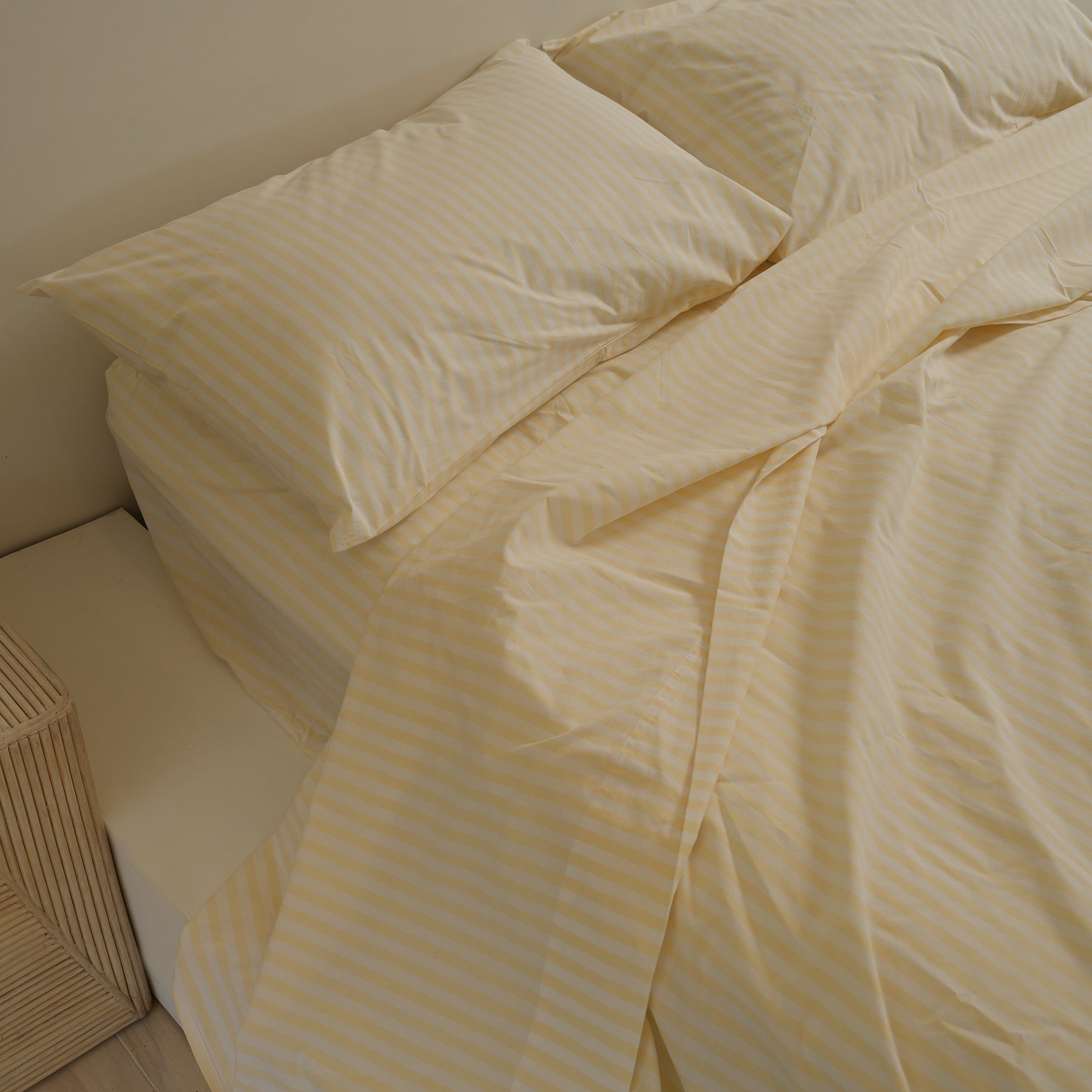 100% stonewashed cotton sheet set in butter stripe, close-up