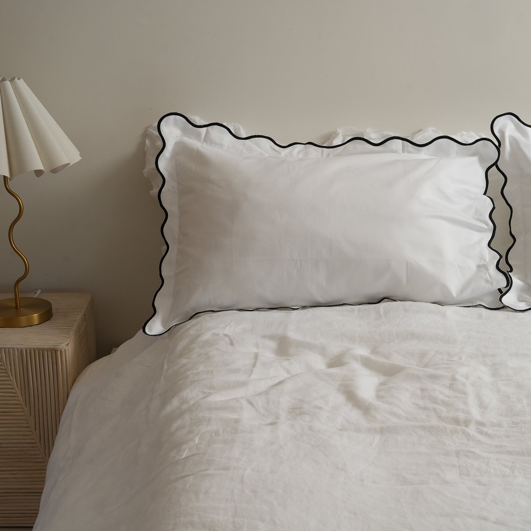 Celine pillowcase pair in black, styled shot
