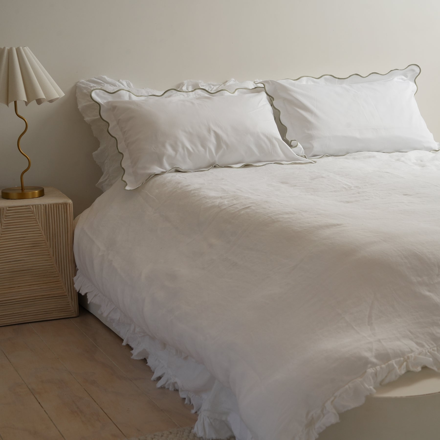 Celine pillowcase pair in sage, styled shot