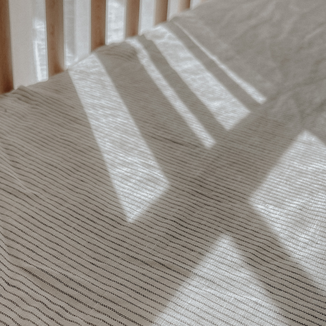 French flax linen fitted cot sheet in Charcoal Pinstripe detail view