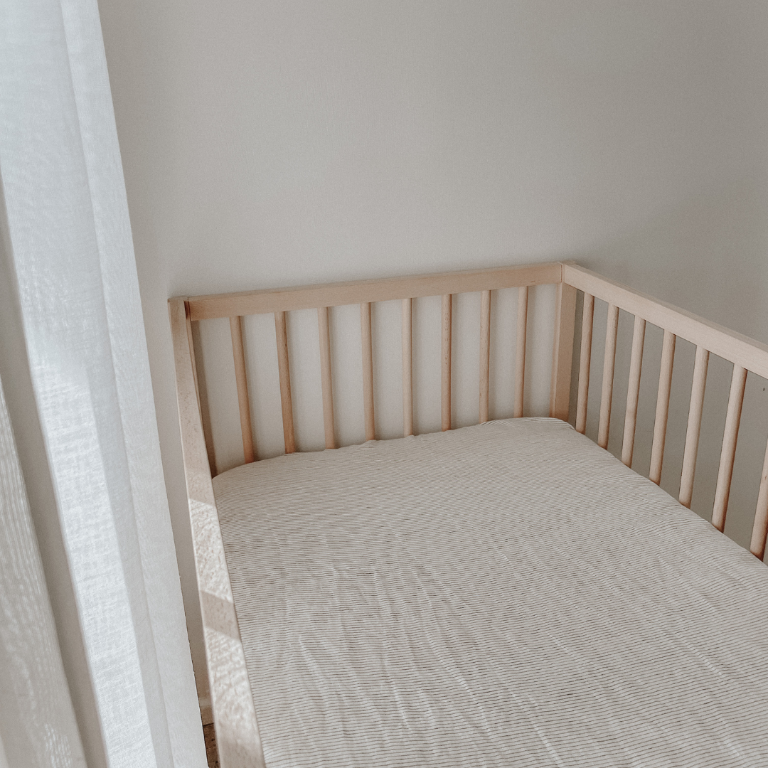 French flax linen fitted cot sheet in Charcoal Pinstripe side view