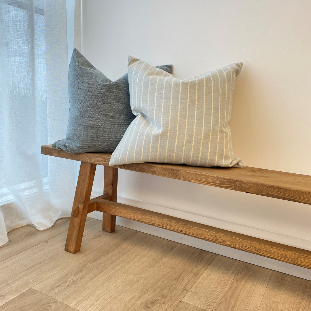 Long reclaimed wood bench in Natural side view