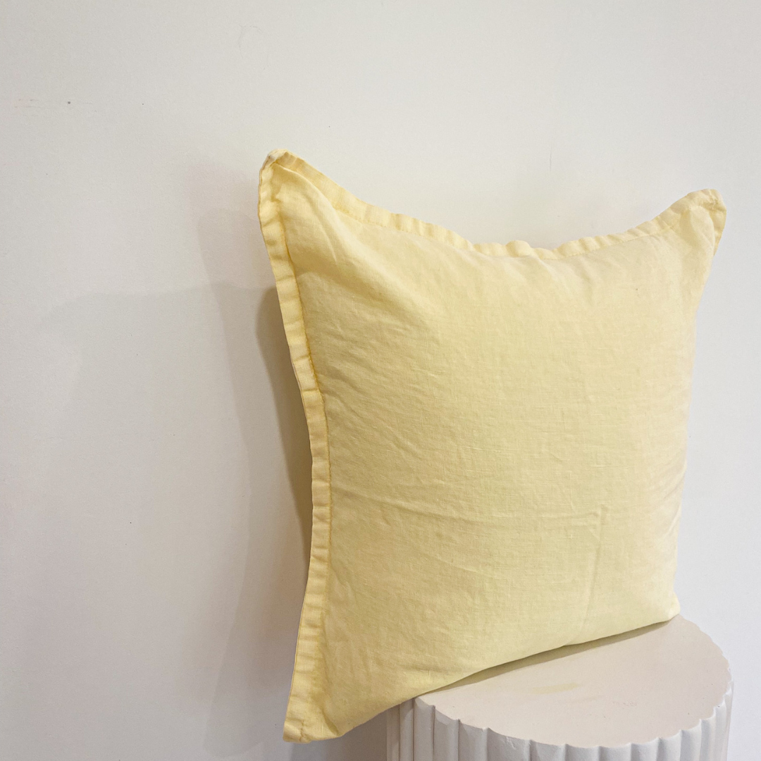 100% belgium linen vintage washed cushion- feather filled in lemoncello, styled shot