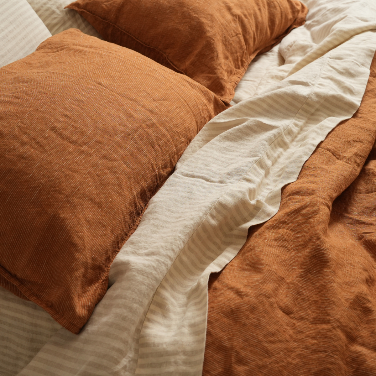 100% french linen pillowcase pair in caramel pinstripe, close-up