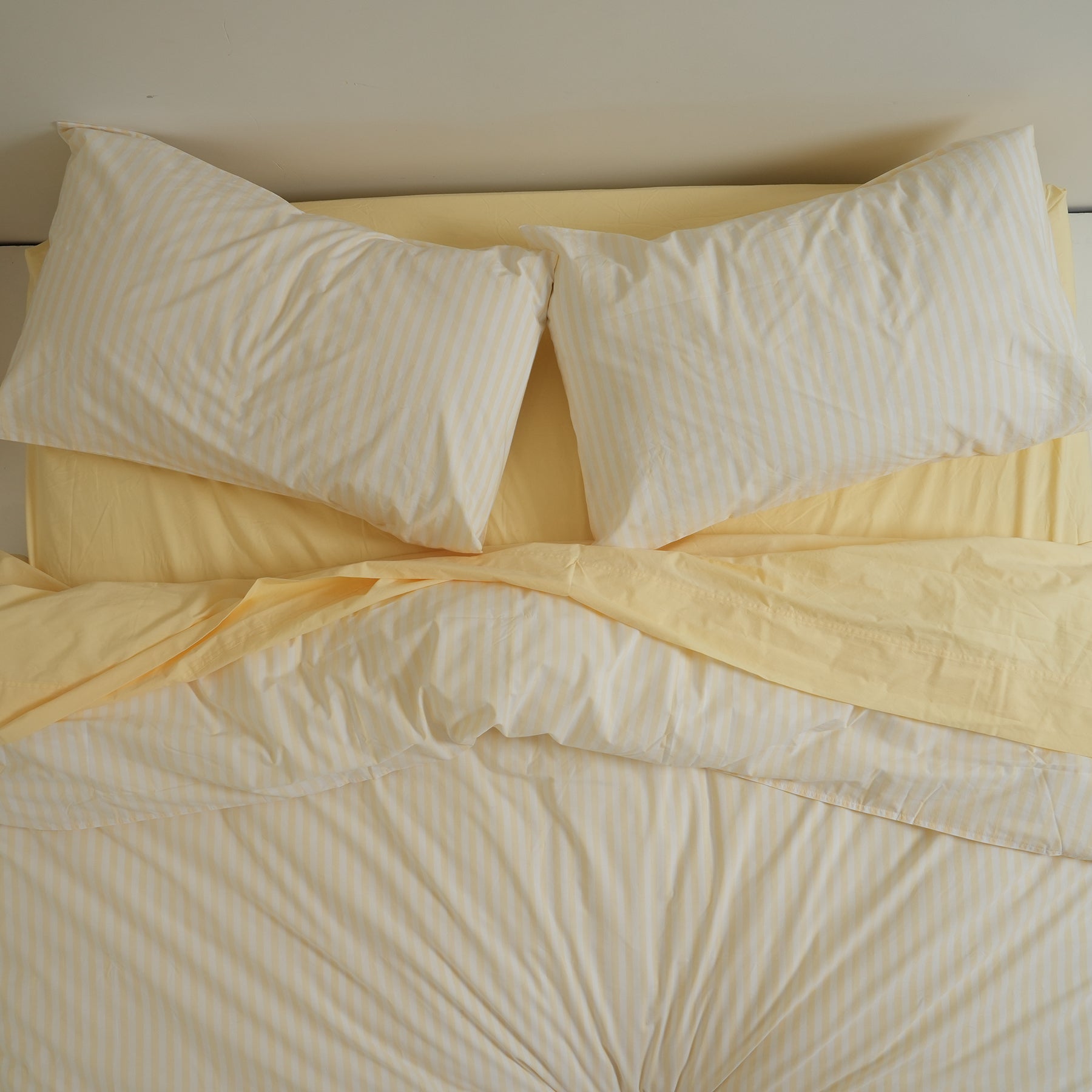 100% stonewashed cotton pillowcase pair in butter stripe, detail view