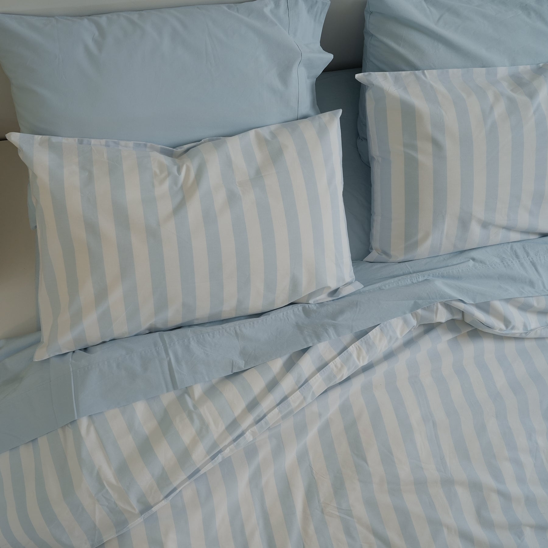 100% stonewashed cotton pillowcase pair in sky blue stripe, detail view