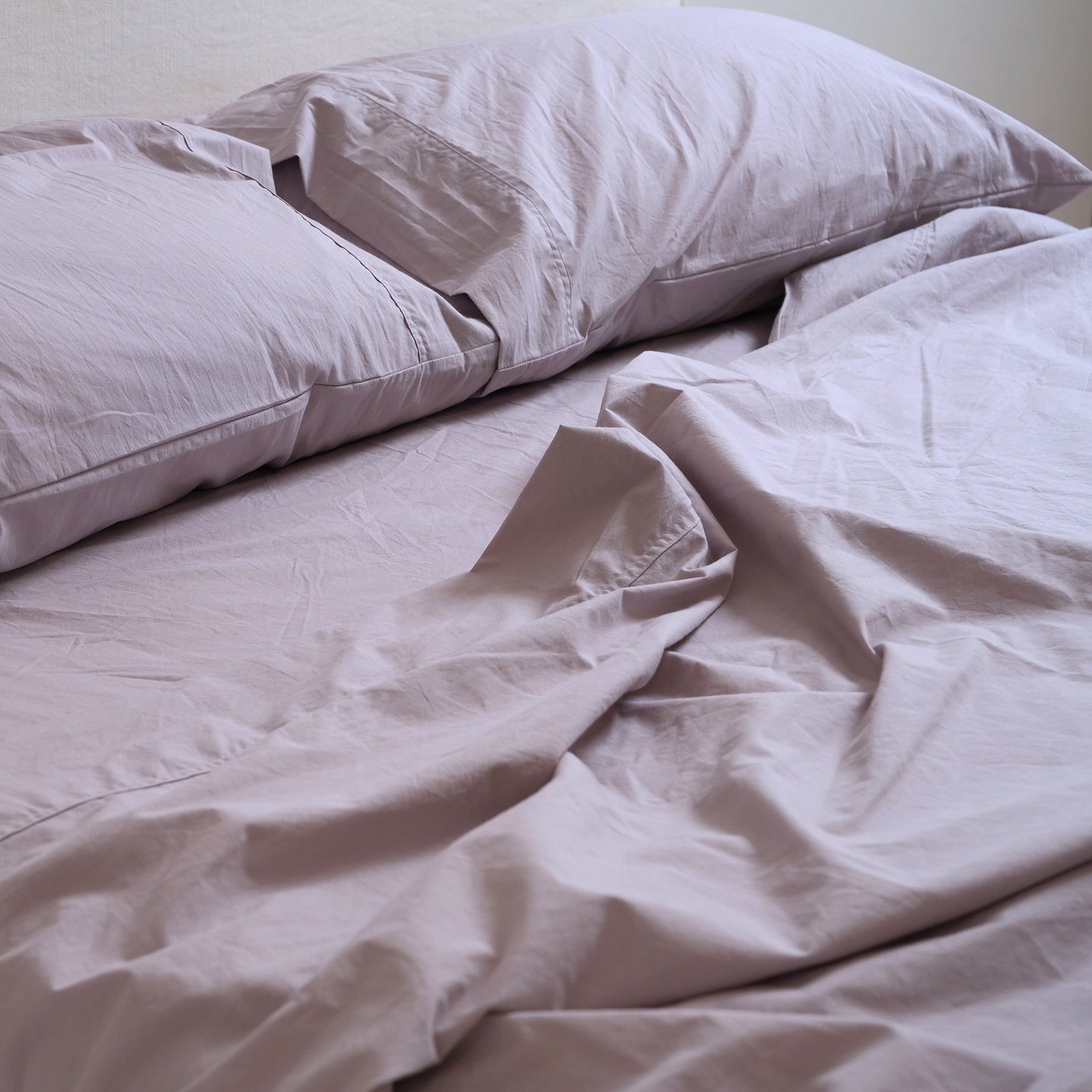 100% stonewashed cotton sheet set in lavender, styled shot