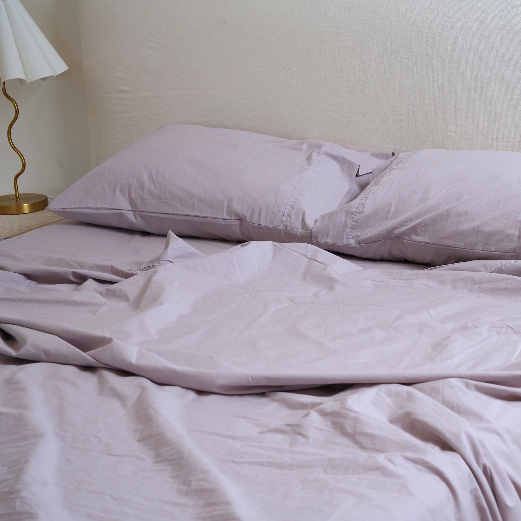 100% stonewashed cotton sheet set in lavender, side view