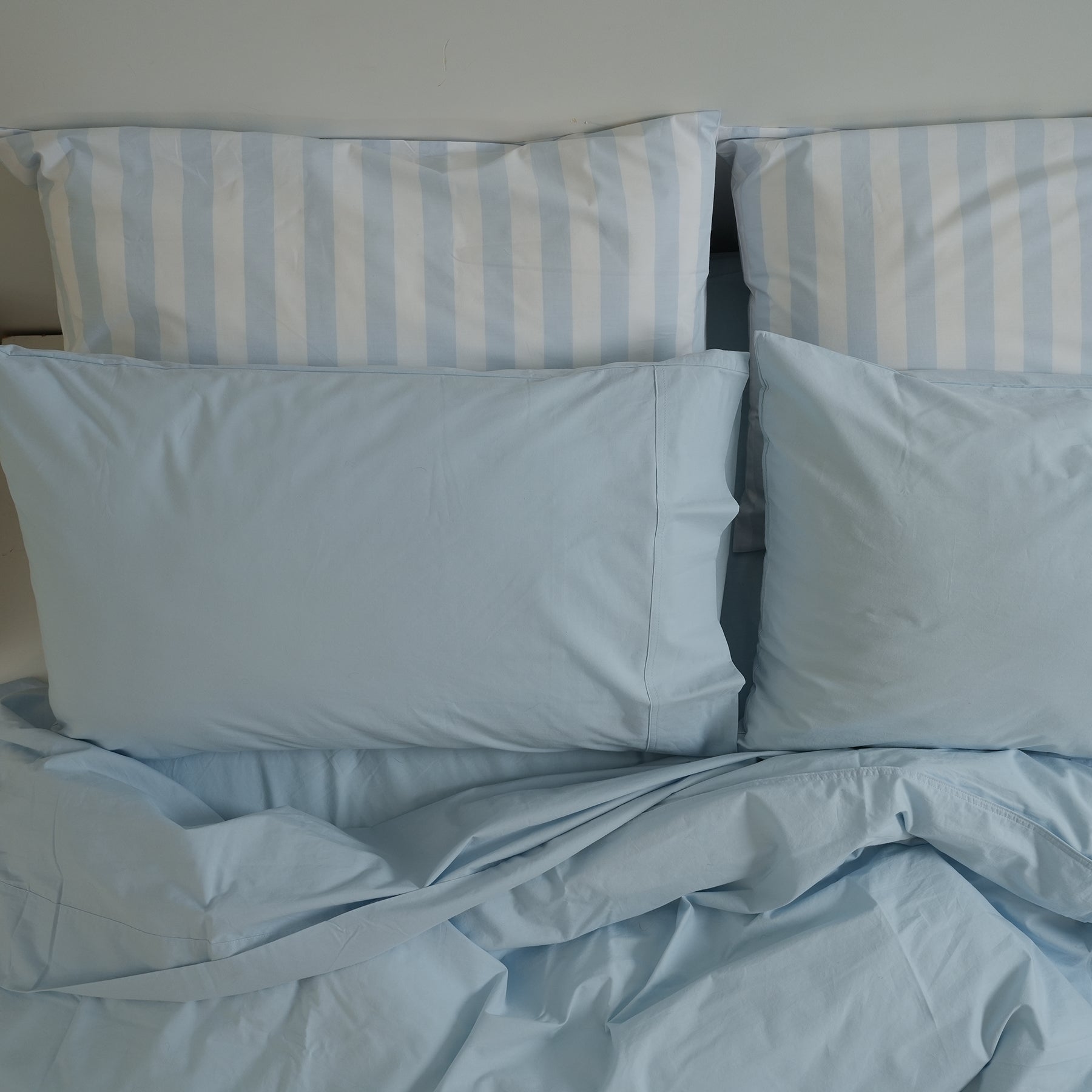 100% stonewashed cotton sheet set in sky blue, styled shot