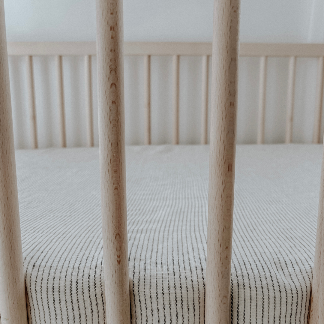 French flax linen fitted cot sheet in Charcoal Pinstripe side view