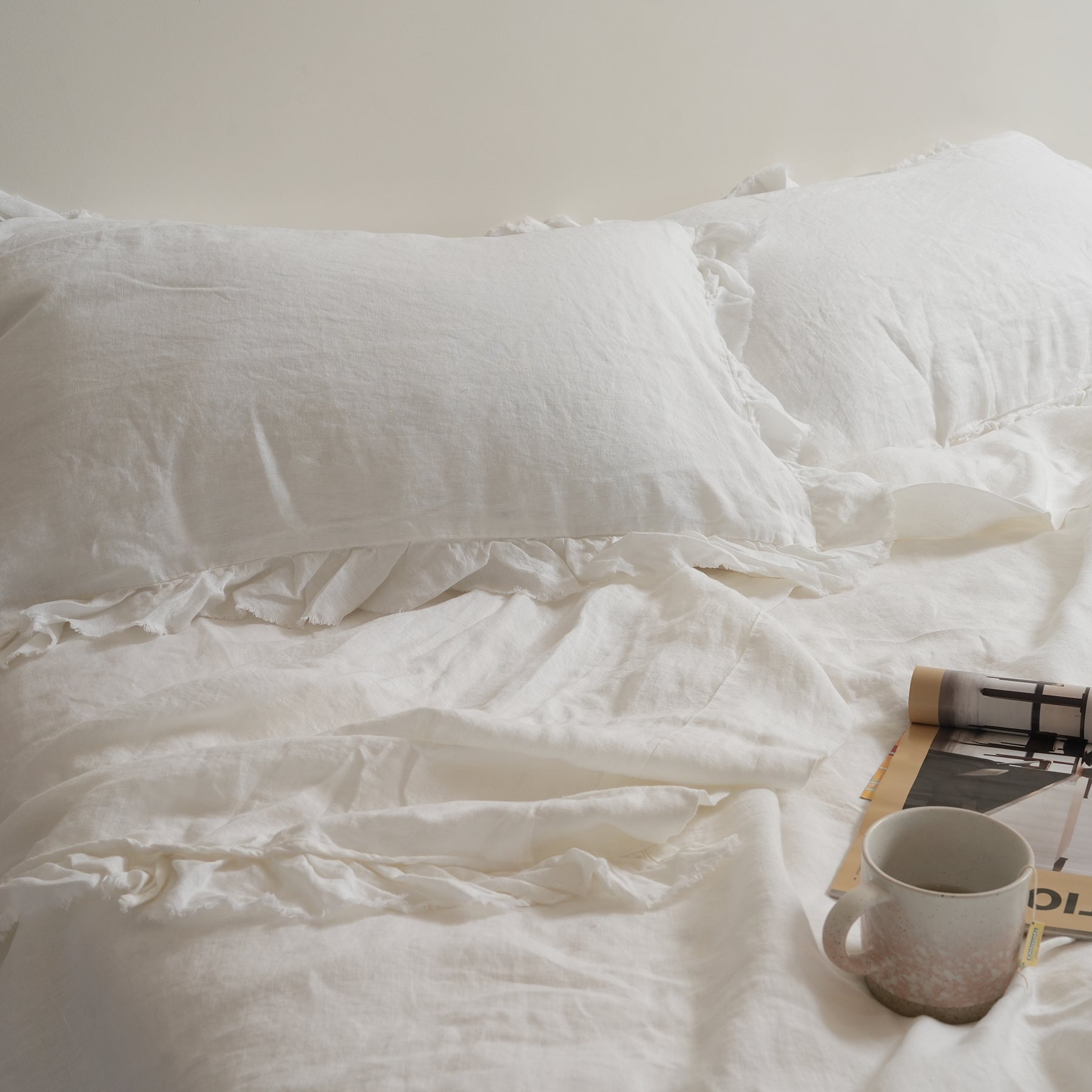 French flax linen ruffle edge pillowcase pair in White close-up of fabric