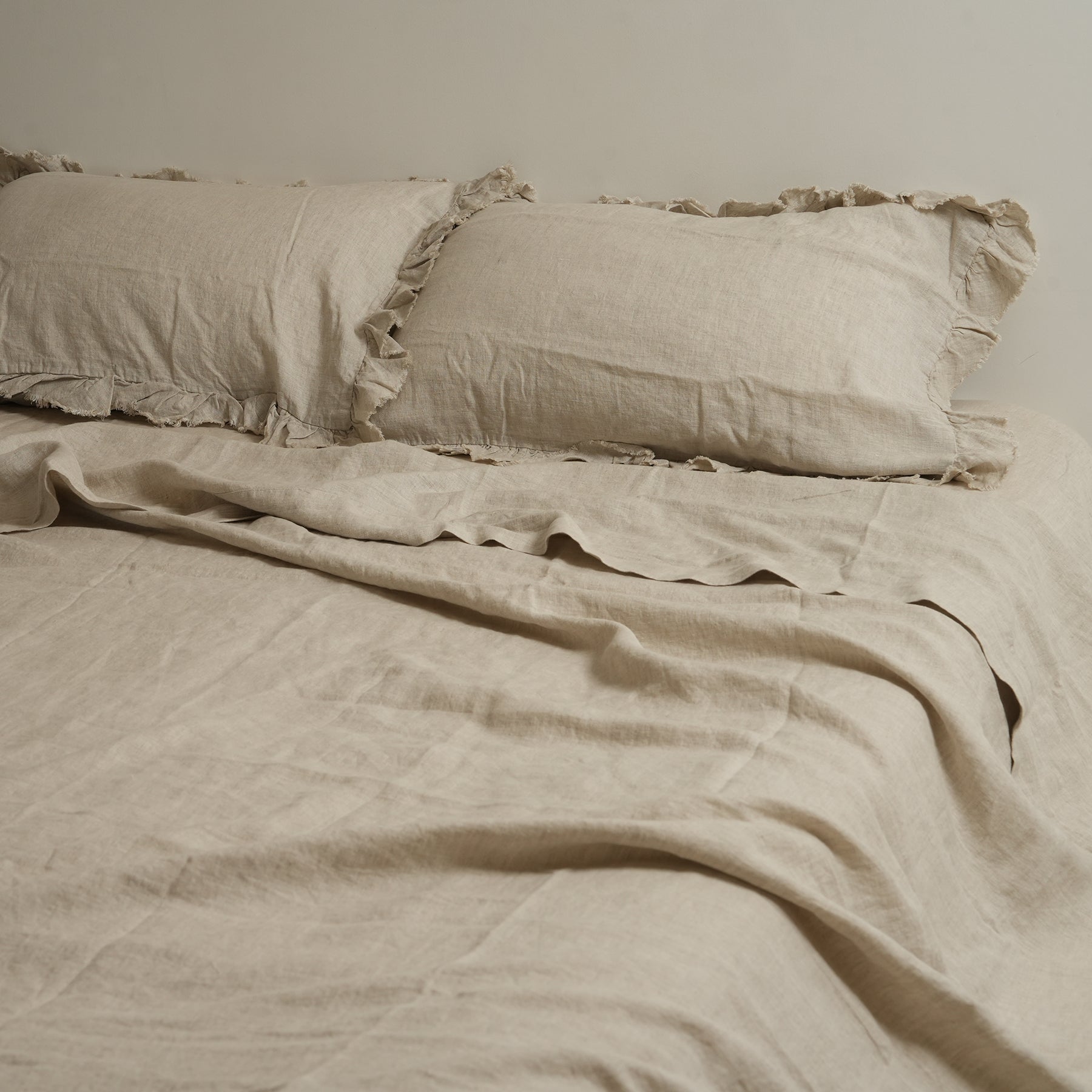 French flax linen ruffle edge sheet set in Natural Oat close-up of fabric