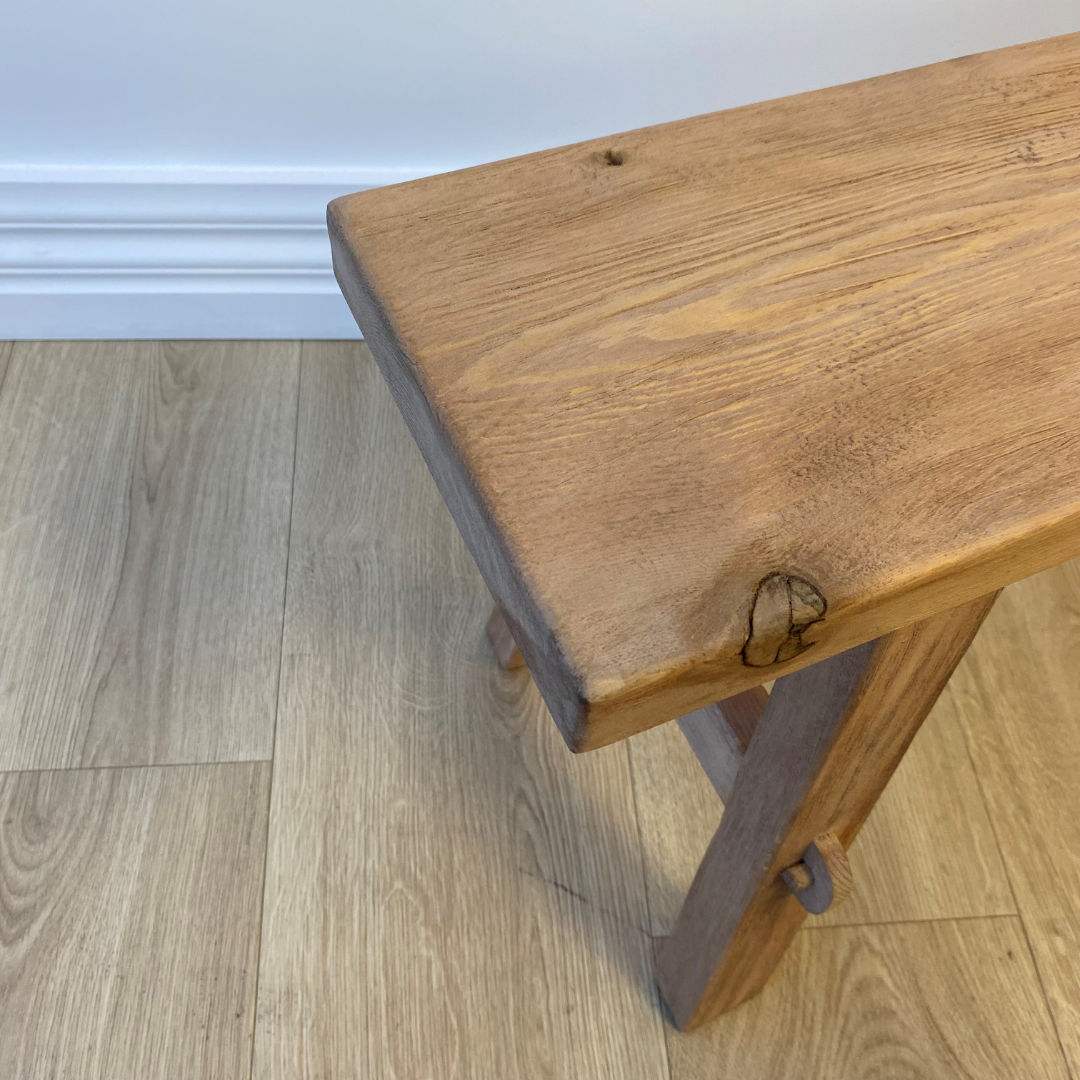 Medium reclaimed wood bench in Natural side view