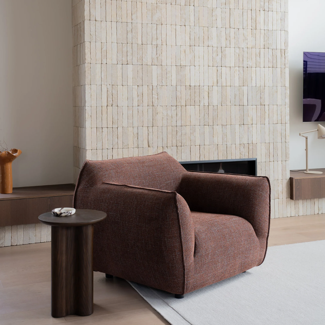 Nearly Famous armchair, rounded silhouette, plush upholstery, detail view
