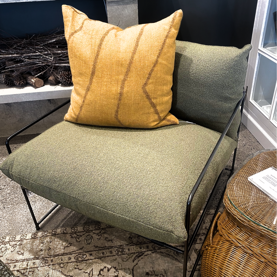 Sammie boucle sling chair in olive, styled shot