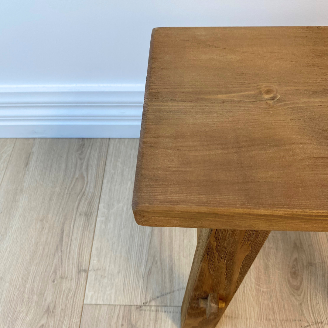Small reclaimed wood bench in natural, close-up