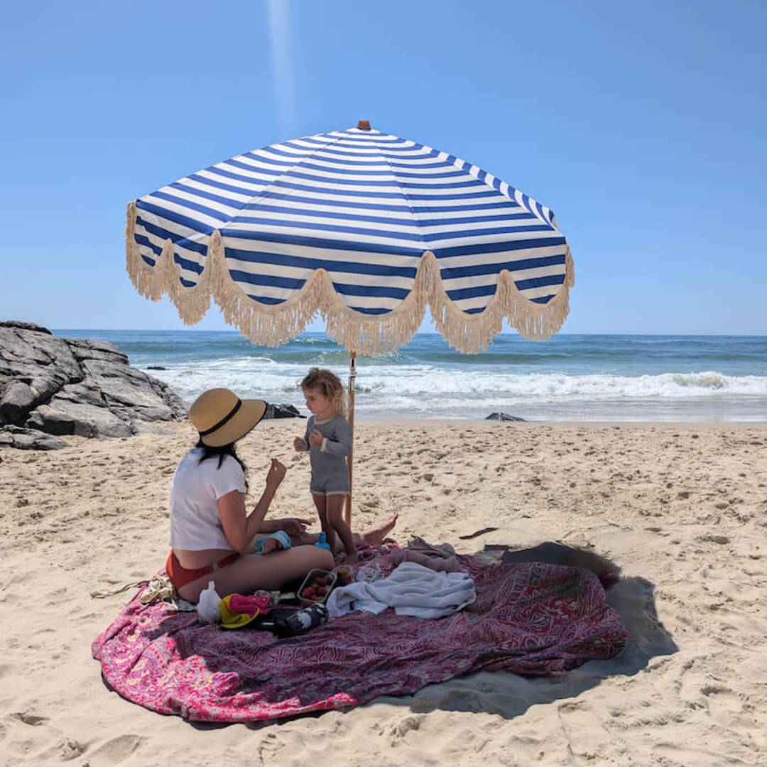 Summer sun umbrella in blue bayou, side view