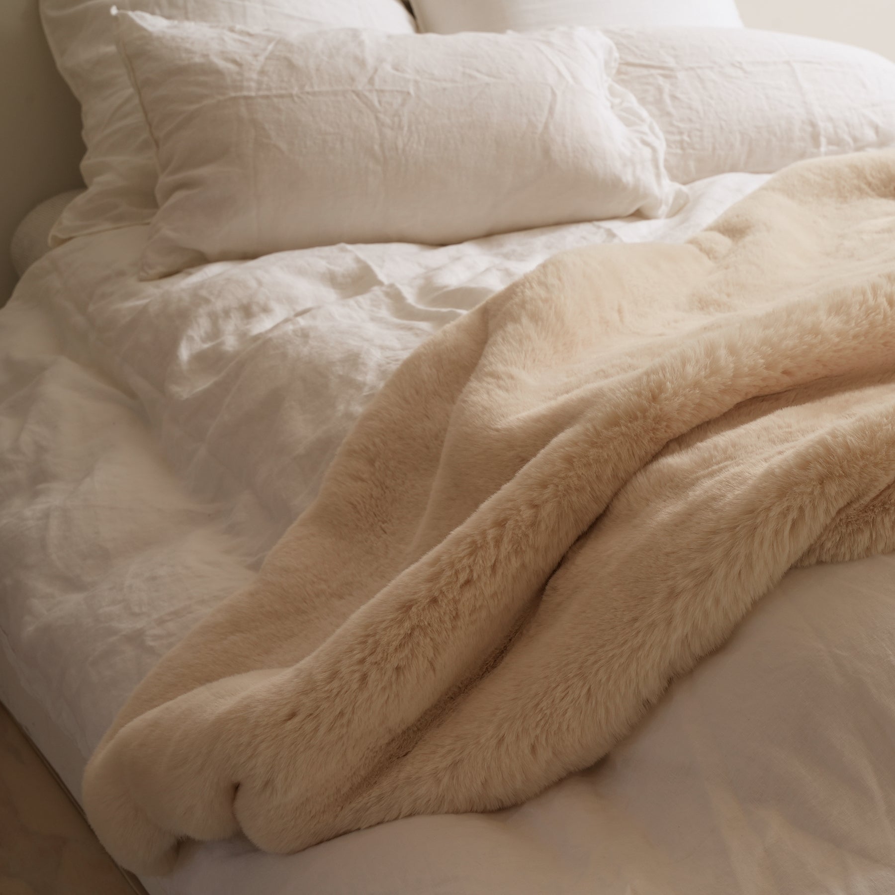 Vegan fur throw in big bear cream, styled shot